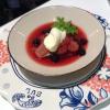 Compote of blackberries and apples with softly whipped cream 